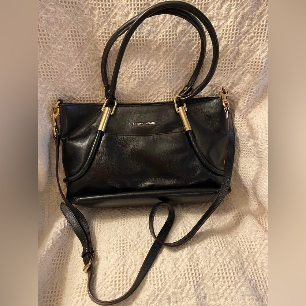 Antonio Melani black handbag. Like new. Gold detail. Dust sleeve include…